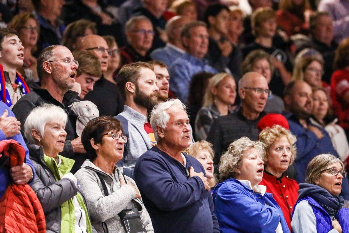 Attendees sing the national anthem at a Make America Great Again rally in Rochester, Minn., on Oct. 4, 2018. (Charlotte Cuthbertson/The Epoch Times)