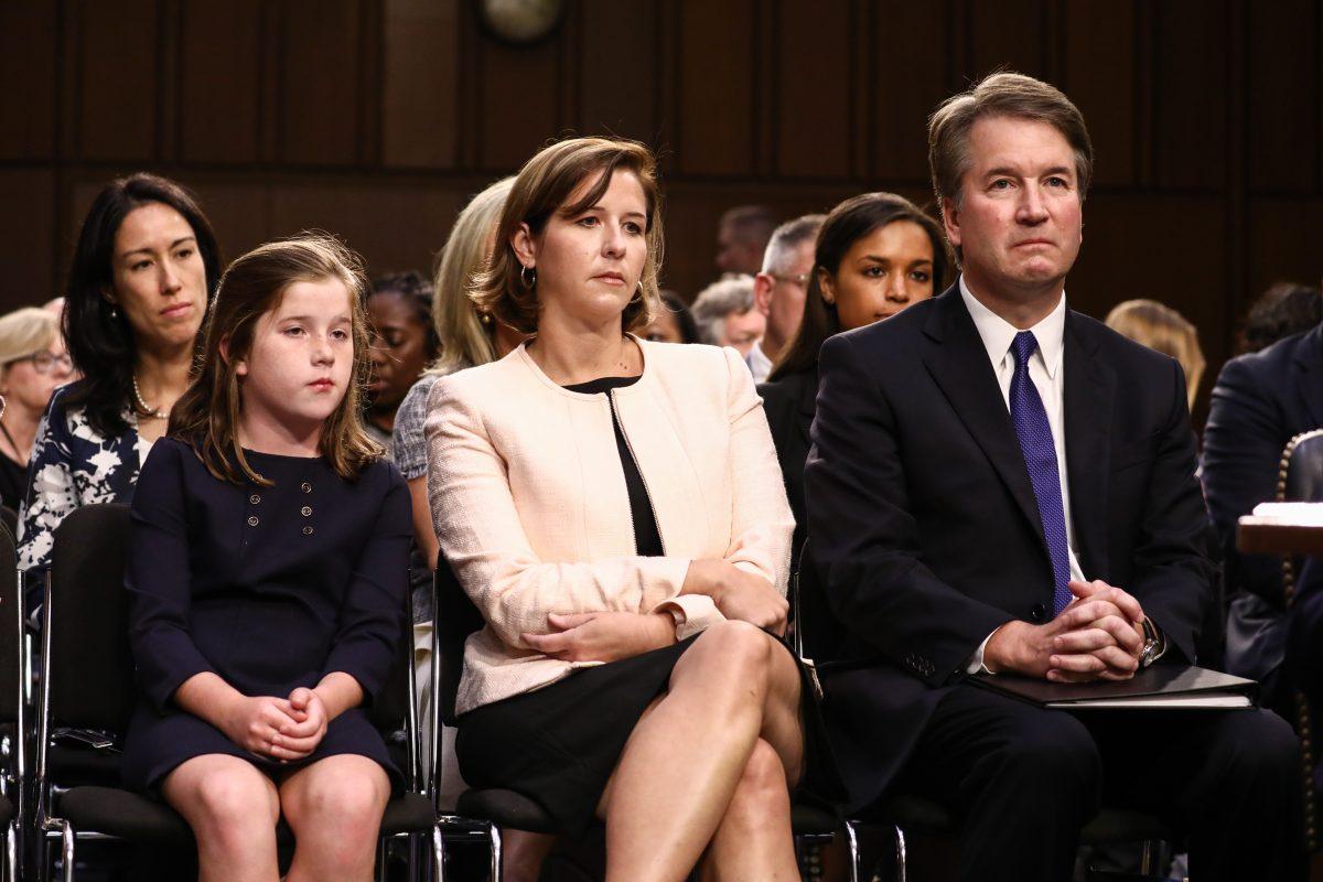 Judge Brett Kavanaugh sits next to his wife Ashley Kavanaugh, and daughter Liza, before the Senate Judiciary Committee during the first day of his confirmation hearing to serve as Associate Justice on the U.S. Supreme Court at the Capitol in Washington on Sept. 4, 2018. (Samira Bouaou/The Epoch Times)