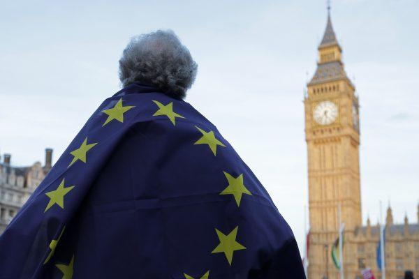 A protester draped in a European Union flag outside the Houses of Parliament in London on March 13, 2017. (Daniel Leal-Olivas/AFP/Getty Images)