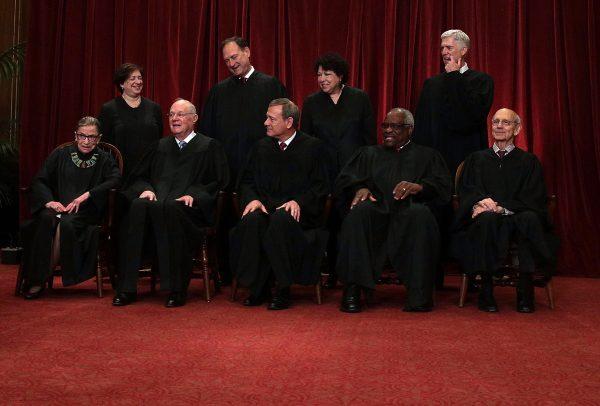 Front row from (L), U.S. Supreme Court Associate Justice Ruth Bader Ginsburg, Associate Justice Anthony M. Kennedy, Chief Justice John G. Roberts, Associate Justice Clarence Thomas, and Associate Justice Stephen Breyer, back row from (L), Associate Justice Elena Kagan, Associate Justice Samuel Alito Jr., Associate Justice Sonia Sotomayor, and Associate Justice Neil Gorsuch on June 1, 2017. (Alex Wong/Getty Images)