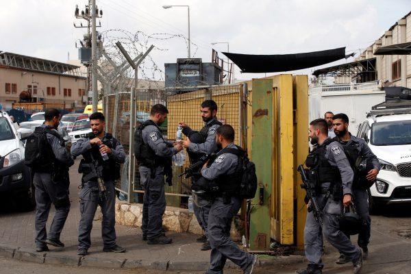 Israeli policemen patrol near the scene where, according to Israeli media, a Palestinian shot and wounded three Israelis, at an industrial park adjacent to a Jewish settlement in the occupied West Bank, on Oct. 7, 2018. (Ronen Zvulun/Reuters)