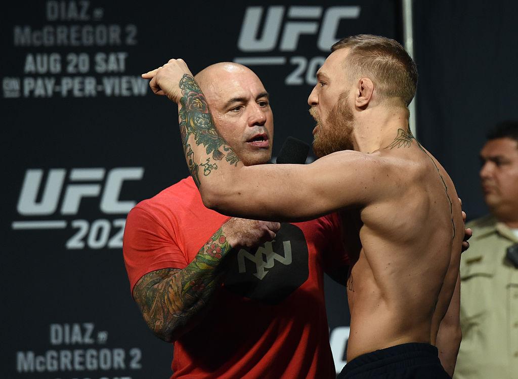 File photo of commentator Joe Rogan (L) interviewing UFC featherweight champion Conor McGregor during his weigh-in for UFC 202 at MGM Grand Conference Center on Aug. 19, 2016, in Las Vegas, Nevada. (Ethan Miller/Getty Images)