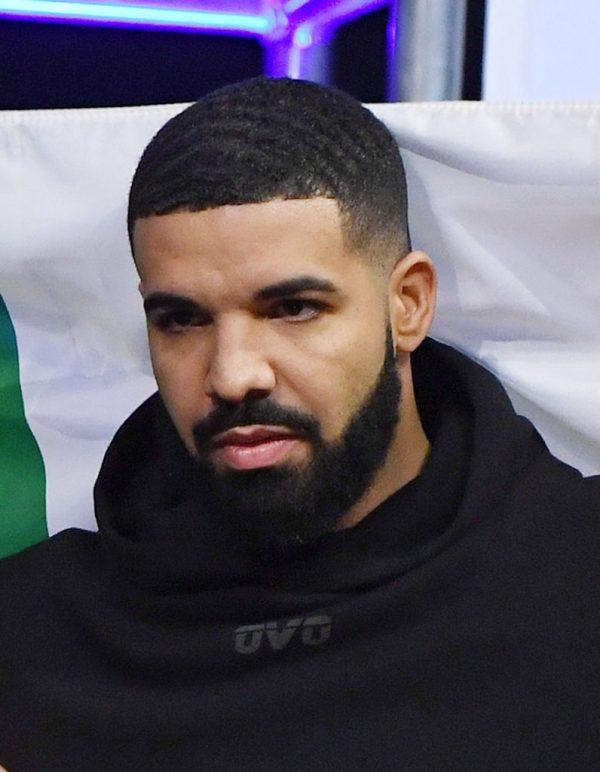 Drake carries an Irish flag as he attends Conor McGregor's ceremonial weigh-in for UFC 229 at T-Mobile Arena on Oct. 05, 2018 in Las Vegas, Nevada. (Photo by Ethan Miller/Getty Images)