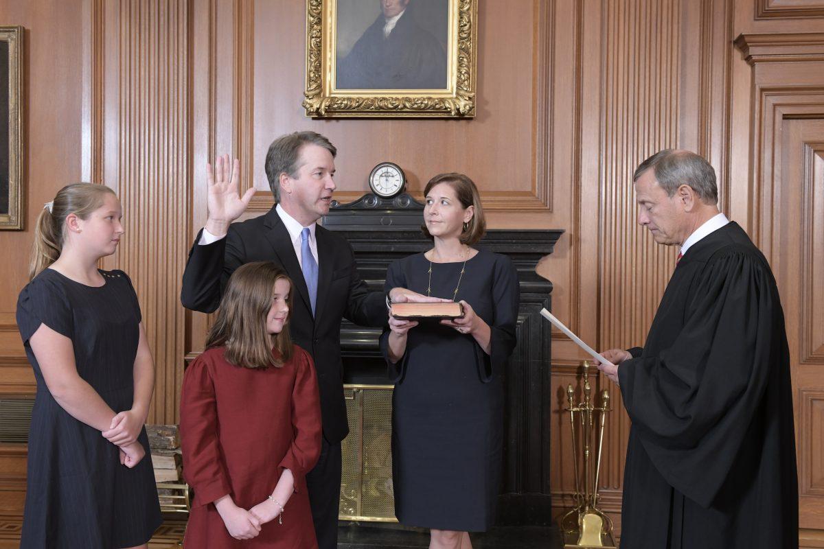 Chief Justice John G. Roberts, Jr., administers the Constitutional Oath to Judge Brett M. Kavanaugh in the Justices’ Conference Room, Supreme Court Building on Oct. 6, 2018. (Fred Schilling/Collection of the Supreme Court of the United States.)