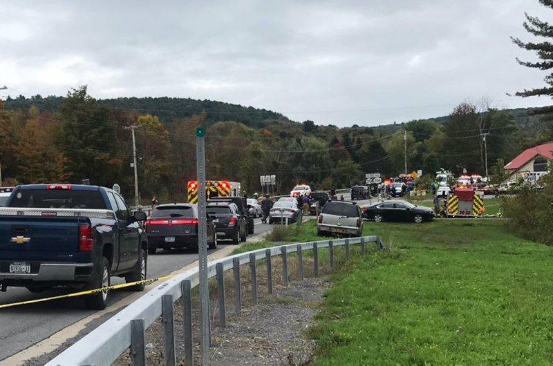 Emergency personnel respond to the scene of a deadly crash in Schoharie, N.Y on Oct. 6, 2018. (WTEN via AP)