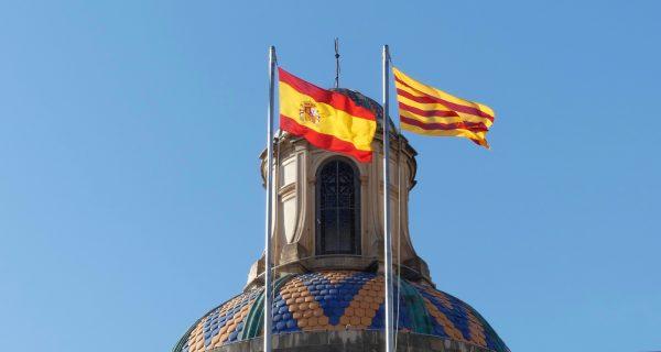 The Catalan and Spanish flags on Palau de la Generalitat, seat of the government of Catalonia, in Barcelona, Spain, on Oct. 3, 2018. (Anna Llado/Special to The Epoch Times)