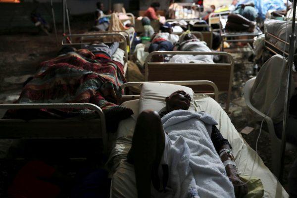 People injured in an earthquake that hit northern Haiti late on Saturday, sleep in a tent, in Port-de-Paix, Haiti, on Oct. 7, 2018. (Ricardo Rojas/Reuters)