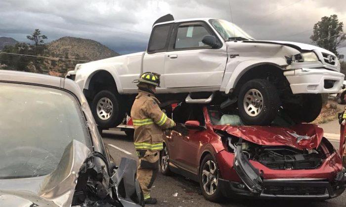 Pictures Show Sideswiped Truck After It Flipped, Landed on Another Car