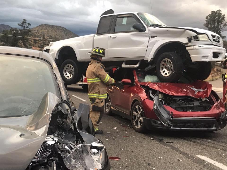 A car crash in Prescott, Ariz., ended with a truck on top of a car, on Oct. 7, 2018. (Prescott Fire Department)