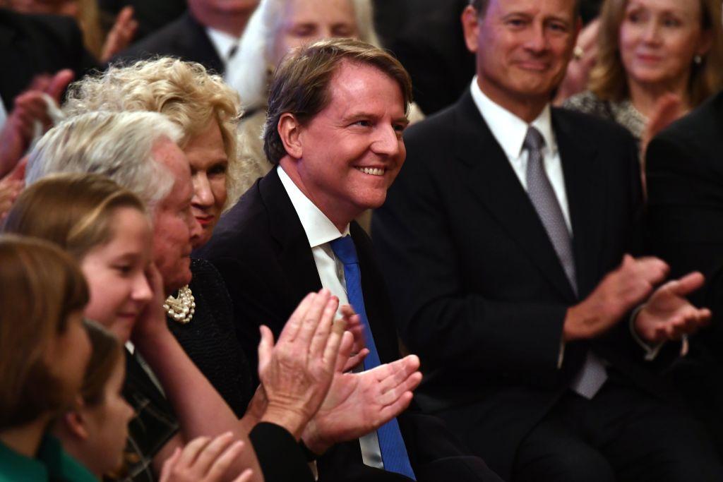 (L-R) Brett Kavanaugh's parents Everett Edward Kavanaugh and Martha Kavanaugh, and White House Counsel Don McGahn at Kavanaugh's swearing-in ceremony as Associate Justice of the Supreme Court at the White House on Oct.8, 2018. (BRENDAN SMIALOWSKI/AFP/Getty Images)