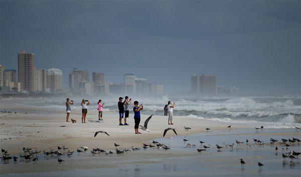 People look out to the Gulf of Mexico in Panama City Beach, Florida as Hurricane Michael approaches Oct. 9, 2018 (Brendan Smialowski/AFP/Getty Images)