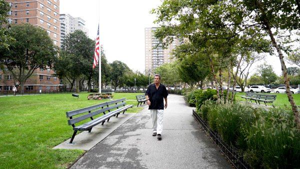 Ronnie Tishkevich walking through the park where he takes Michael. (Shenghua Sung/The Epoch Times)