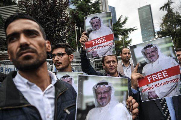 Protestors hold pictures of missing journalist Jamal Khashoggi during a demonstration in front of the Saudi Arabian consulate in Istanbul, on Oct. 8, 2018. (Ozan Kose/AFP/Getty Images)