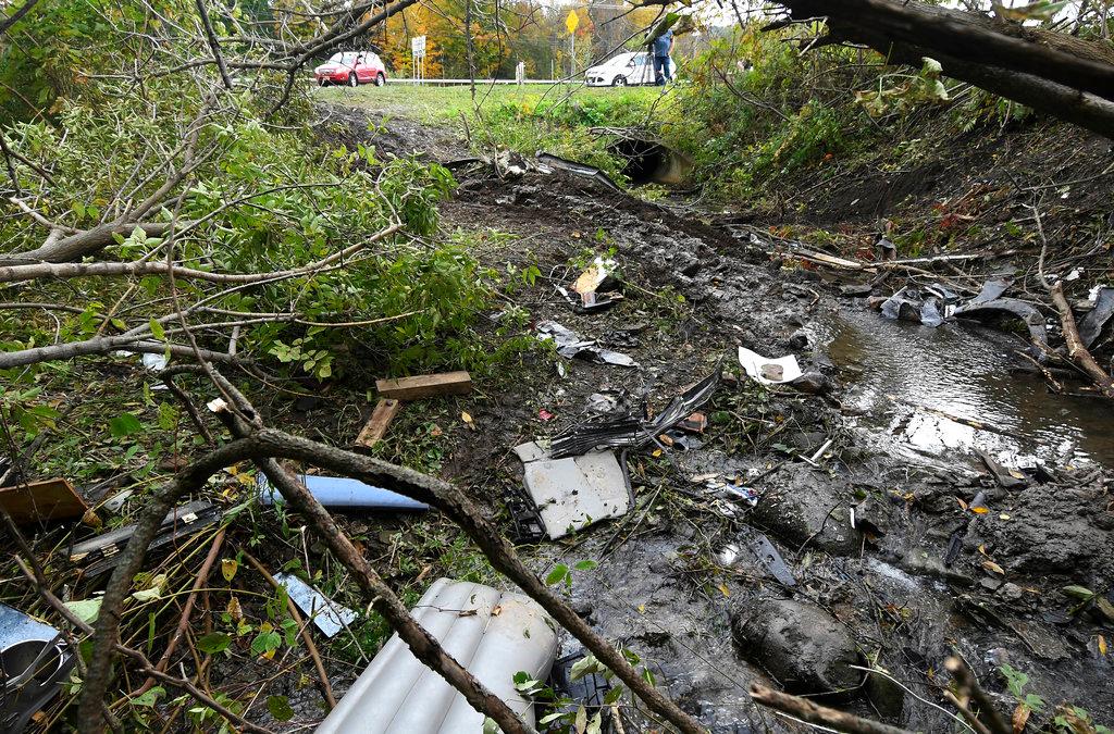 Debris scatters an area at the site of a fatal limousine crash in Schoharie, N.Y., on Oct. 7, 2018. (Hans Pennink/AP Photo)
