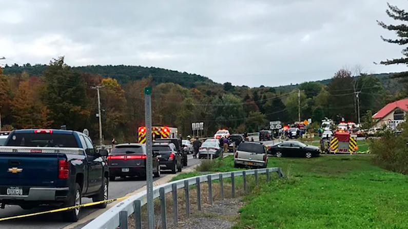 Emergency personnel respond to the scene of a deadly crash in Schoharie, N.Y., on Oct. 6, 2018. (WTEN via AP)