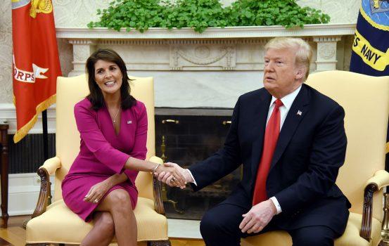 President Donald Trump shakes hands with Nikki Haley, U.S. Ambassador to the United Nations, in the Oval Office of the White House in Washington on Oct. 9, 2018. (Olivier Douliery/AFP/Getty Images)