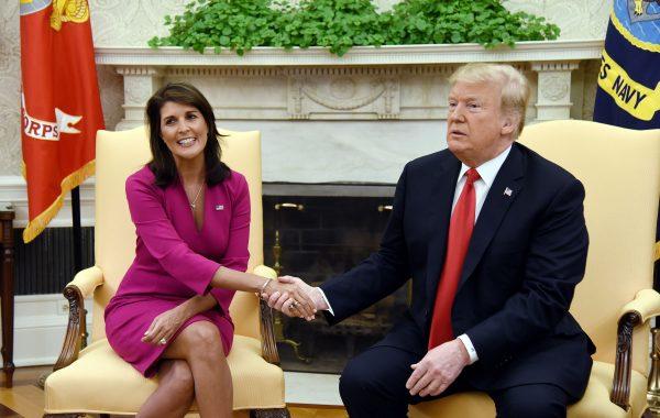President Donald Trump shakes hands with Nikki Haley, the United States Ambassador to the United Nations in the Oval office of the White House in Washington, DC on Oct. 9, 2018. (Olivier Douliery/AFP/Getty Images)