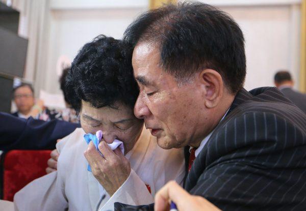 North Korean Jang Gi Sun, 77, cries with her South Korean brother Jang Ju-hwan, 74, as they bid farewell at the last meeting of a three-day family reunion event at North Korea's Mount Kumgang resort on Aug. 26, 2018. (Korea Pool/AFP/Getty Images)