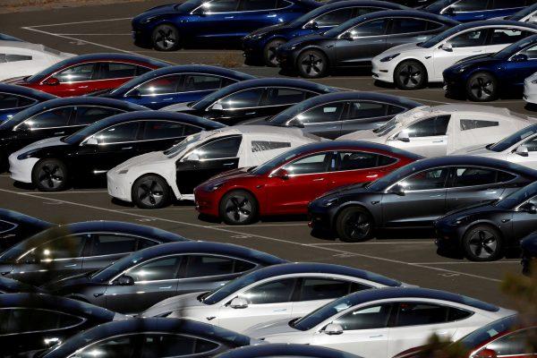 Rows of the new Tesla Model 3 electric vehicles are seen in Richmond, Calif., on June 22, 2018. (Stephen Lam/Reuters)