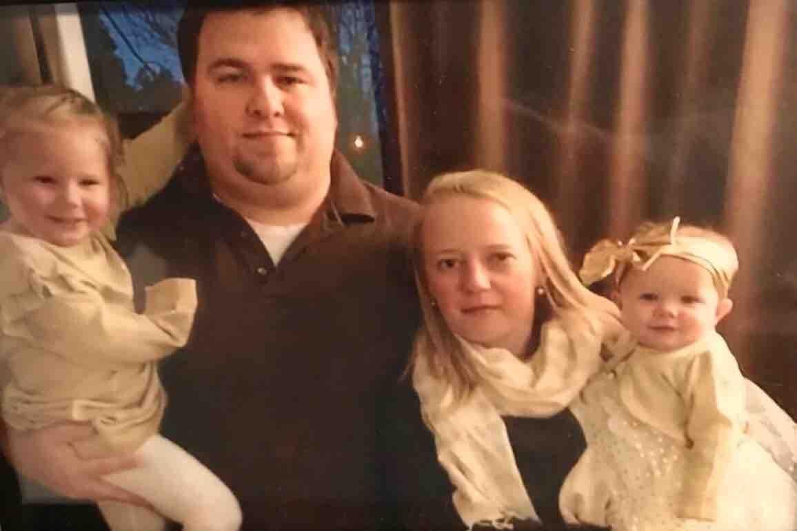 Adam Jackson and wife Abigail pictured with their two children. (GoFundMe)