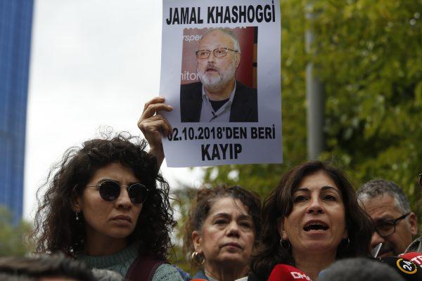 Activists, members of the Human Rights Association Istanbul branch, holding posters with photos of missing Saudi journalist Jamal Khashoggi in Istanbul, Turkey, on Oct. 9, 2018. (Lefteris Pitarakis/AP)
