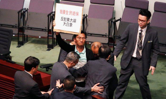 Some Hong Kong Lawmakers Walk Out of Policy Address Over Media ‘Persecution’