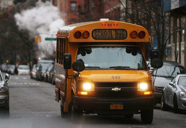 A school bus drives down a street in Manhattan's East Village in New York City on Jan. 15, 2013. (Mario Tama/Getty Images)