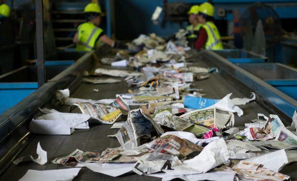 Workers sort through recycling material at the Waste Management Material Recovery Facility in Elkridge, Md., on June 28, 2018. (Saul Loeb/AFP/Getty Images)