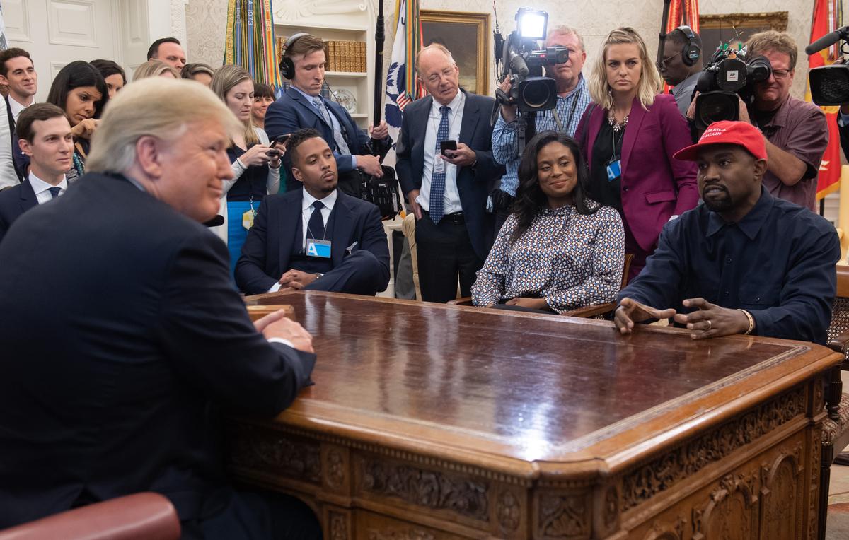 President Donald Trump meets with rapper Kanye West (R) in the Oval Office of the White House in Washington, DC, on Oct. 11, 2018. (Saul Loeb/AFP/Getty Images)