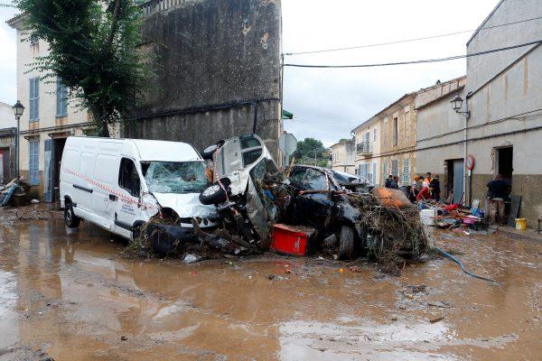 Destroyed cars on the streets as heavy rain and flash floods hit Sant Llorenc de Cardassar on the island of Majorca, Spain, Oct. 10, 2018. (Enrique Calvo/Reuters)