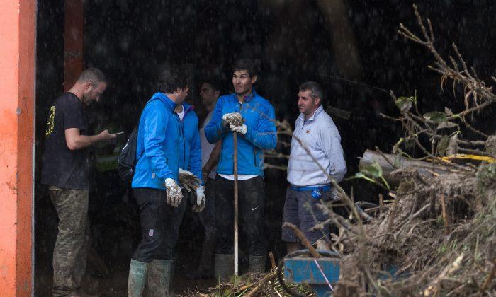 Tennis Ace Rafael Nadal Helps Clean Up Flood Devastation on Spanish Island Majorca