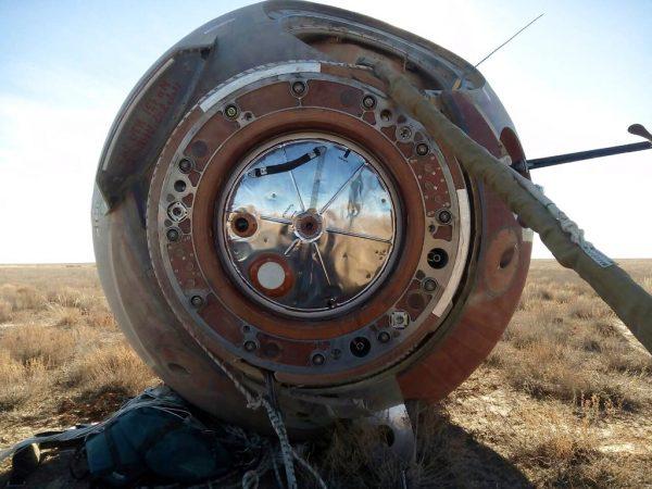 In this photo provided by Russian Defense Ministry Press Service, the Soyuz MS-10 space capsule lays in a field after an emergency landing near Dzhezkazgan, about 450 kilometers (280 miles) northeast of Baikonur, Kazakhstan, on Oct. 11, 2018. (Russian Defense Ministry Press Service photo via AP)