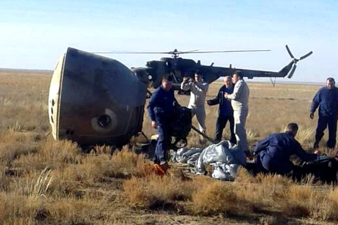 Space Crew Survives Plunge to Earth After Russian Rocket Fails