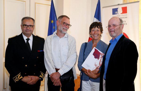Amanda Holmes and her husband Robin hold a French naturalization decree during a citizenship ceremony at the Sub-Prefecture in Niort, France, on Oct. 9, 2018. (Reuters/Stephane Mahe)