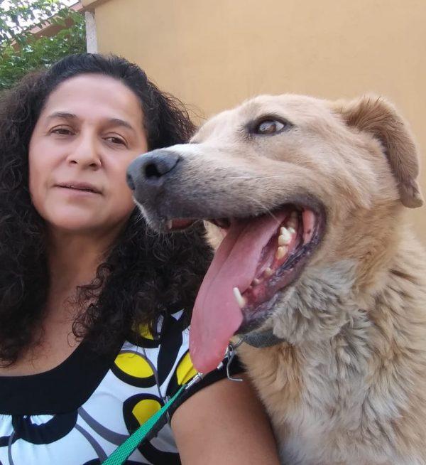 Ana Gloria Hernandez Felix at her dog shelter with a rescued dog in Juarez, Mexico. (Courtesy of Ana Gloria Hernandez Felix)