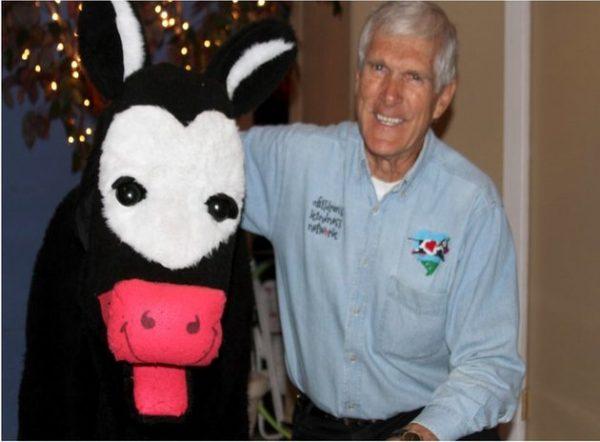 Ted Dreier, known as Farmer Ted, and the robotic, talking cow he invented in his garage in 1998. (Courtesy of Ted Dreier)