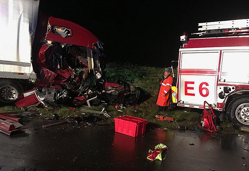 A tractor-trailer crashed into the back of a fire truck on I-295 in Hanover County, Virginia on Oct. 11, killing one firefighter and severely injuring three, including the driver. (Virginia State Police)