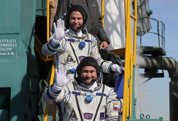 International Space Station (ISS) crew members astronaut Nick Hague of the U.S. and cosmonaut Alexey Ovchinin of Russia board the Soyuz MS-10 spacecraft for the launch at the Baikonur Cosmodrome, Kazakhstan, on Oct. 11, 2018. (Yuri Kochetkov/Pool/Reuters)
