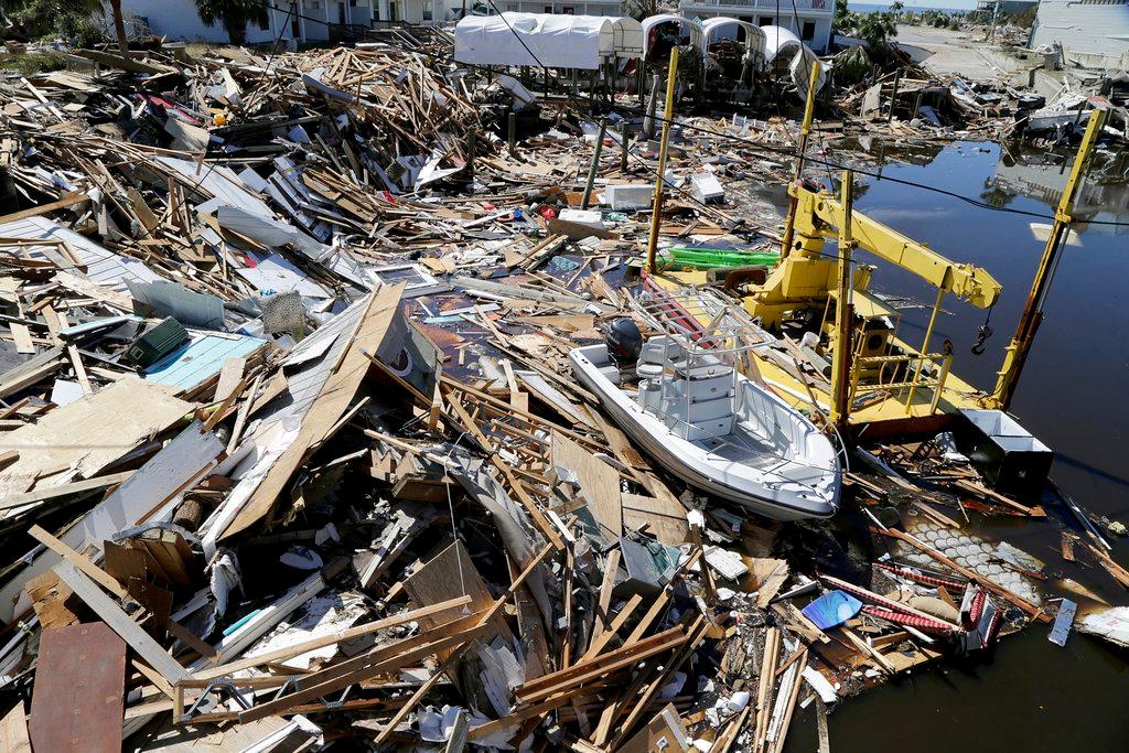 Boats are seen among the rubble along the canals Oct. 12, 2018, in Mexico Beach, Fla., two days after a Category 4 Hurricane Michael devastated the small coastal town just outside Panama City, Fla. (Pedro Portal/Miami Herald via AP)