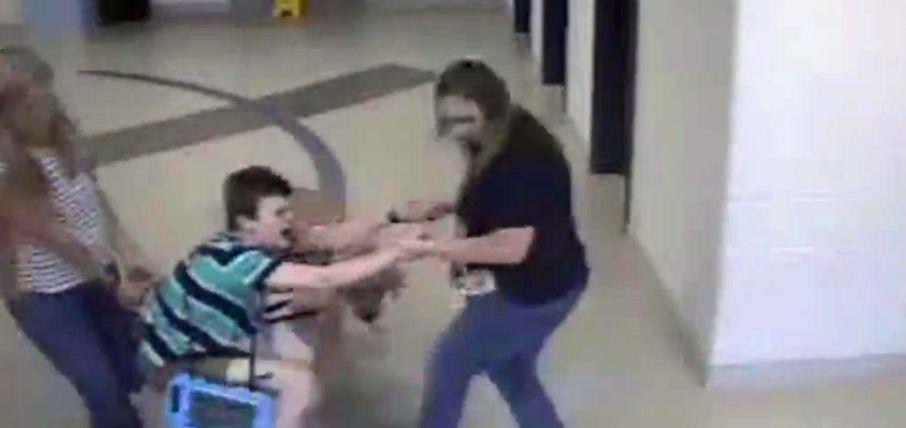Video footage posted by a school in Lexington, Kentucky, shows staff members dragging an autistic child through the facility. (Fayette County Public Schools)