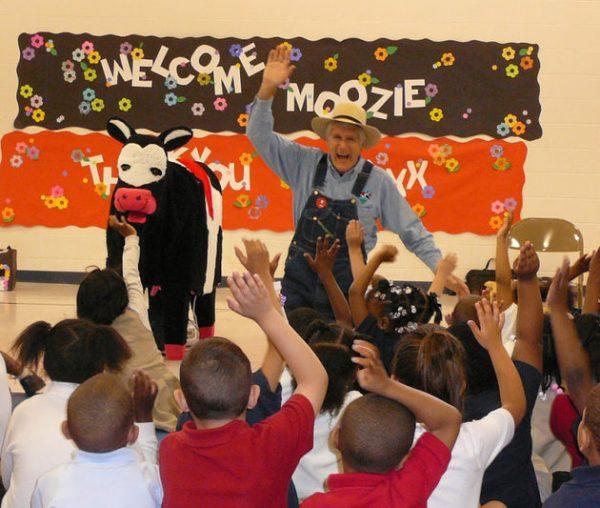 Farmer Ted promotes empathy during a presentation with Moozie the Cow at Fall-Hamilton Elementary School in Nashville, Tennessee. (Courtesy of Ted Dreier)