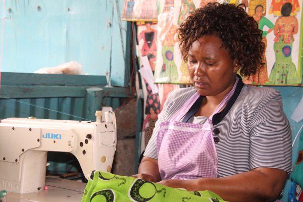Peninah Mueni at her tailoring shop in Mukuru, Nairobi, Kenya, on Oct. 10, 2018. (Reuben Kyama/Special to The Epoch Times)