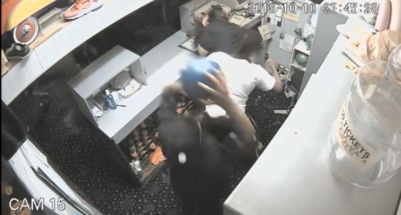 Police in Roseville, Mich., released security camera footage of a group of men violently beating a bowling alley employee before a man threw a bowling ball at his head on Oct. 10, 2018. (Roseville Police)