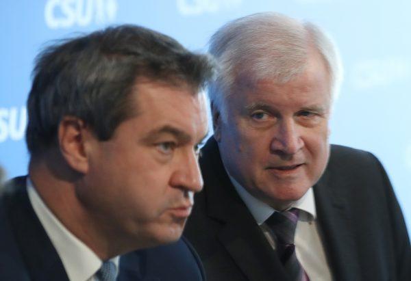 Horst Seehofer (R), Chairman of the Bavarian Social Union (CSU), and Markus Soeder, Governor of Bavaria and lead candidate of the CSU in the Bavarian state elections in Munich, Germany, on Oct. 15, 2018. (Sean Gallup/Getty Images)