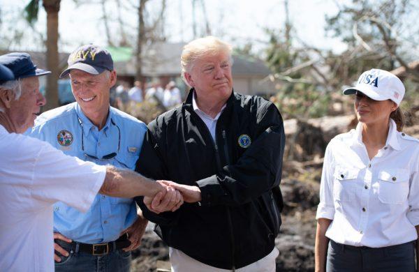 President Donald Trump, First Lady Melania Trump and Florida Governor Rick Scott(L) tour damage from Hurricane Michael in Lynn Haven, Florida, Oct. 15, 2018. (SAUL LOEB/AFP/Getty Images)