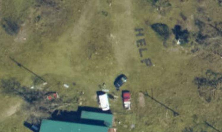A family spelled out the word “HELP” in Florida after Hurricane Michael left a path of devastation. (NOAA)