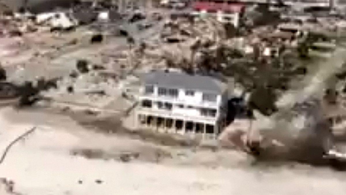 Video footage shared by the U.S. Coast Guard showed the home still standing amid the rubble of destroyed neighborhoods on Oct. 15, 2018. (US Coast Guard video capture)