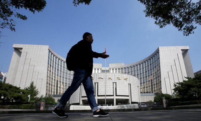 China Loosens Lending Restrictions, Turns on Debt Spigot