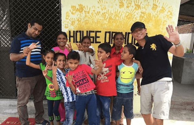 Hughes and Patil hanging out with the original House of Hope kids in 2017. (Courtesy of Jerry Hughes)