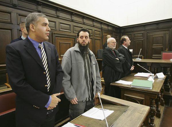 Mounir el-Motassadeq with his team of lawyers at the start of his third re-trial at the state court on Jan. 5, 2007 in Hamburg, Germany. (Stuart Franklin/Getty Images)